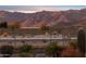 Desert landscaped backyard with a metal fence and mountain views in the distance at 12660 E Pivot Peak --, Gold Canyon, AZ 85118