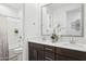 Bathroom with dual sinks, quartz countertops, dark wood cabinets, and a tub-shower combo at 12660 E Pivot Peak --, Gold Canyon, AZ 85118