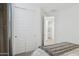 This bedroom contains a closet and an entrance to the laundry room at 12660 E Pivot Peak --, Gold Canyon, AZ 85118