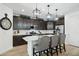 Stylish kitchen with dark cabinets, stainless steel appliances, white subway tile backsplash, and pendant lighting at 12660 E Pivot Peak --, Gold Canyon, AZ 85118