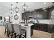 Well-appointed kitchen featuring dark cabinets, stainless appliances, a quartz island, and decorative pendant lights at 12660 E Pivot Peak --, Gold Canyon, AZ 85118