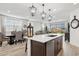 Open-concept design featuring a kitchen island with a sink and seating, perfect for entertaining at 12660 E Pivot Peak --, Gold Canyon, AZ 85118