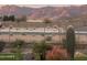 Scenic backyard view with desert landscaping and striking mountain views in the distance at 12660 E Pivot Peak --, Gold Canyon, AZ 85118