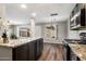 Kitchen area featuring granite countertops and an open layout to the living room at 1310 S Pima -- # 35, Mesa, AZ 85210