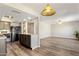 Open kitchen and living room layout featuring pendant lighting and granite countertops at 1310 S Pima -- # 35, Mesa, AZ 85210