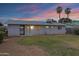 Back exterior view of the home with palm trees at 1324 W 15Th St, Tempe, AZ 85281