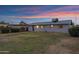 View of the flat, partially-shaded backyard of this single-story home with a low-pitched roof and minimal landscaping at 1324 W 15Th St, Tempe, AZ 85281