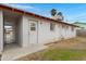 Backyard with covered patio, block fencing and shade trees at 1324 W 15Th St, Tempe, AZ 85281