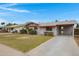 Pleasant single-story home featuring a well-kept lawn and attached carport at 1324 W 15Th St, Tempe, AZ 85281