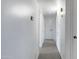 A clean, bright hallway with neutral walls and carpet, connecting different areas of the home at 1324 W 15Th St, Tempe, AZ 85281