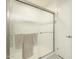 Bathroom showcasing a glass-enclosed shower with chrome fixtures and white tiled walls at 14266 N 2Nd Ave, Phoenix, AZ 85023