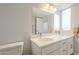 Bathroom featuring a double vanity with stylish fixtures and a well-lit mirror at 14266 N 2Nd Ave, Phoenix, AZ 85023