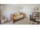 Bedroom showcasing a daybed, closet, and workspace with a comfortable office chair at 14266 N 2Nd Ave, Phoenix, AZ 85023