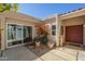 Charming front patio with tiled flooring and desert landscaping at 14266 N 2Nd Ave, Phoenix, AZ 85023