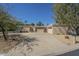 Charming home featuring desert landscaping, a spacious driveway, and an attached garage at 14266 N 2Nd Ave, Phoenix, AZ 85023