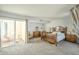 Main bedroom with patio access, warm lighting, and classic decor at 14266 N 2Nd Ave, Phoenix, AZ 85023