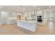 Bright, white kitchen featuring an island and modern appliances at 14770 W Tether Trl, Surprise, AZ 85387