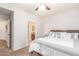 Bedroom featuring a view to the ensuite bathroom, carpet, and neutral decor at 15252 N 100Th St # 1156, Scottsdale, AZ 85260