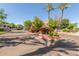 The community entrance has a circular drive with colorful flowerbeds and lush landscaping at 15252 N 100Th St # 1156, Scottsdale, AZ 85260