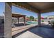 Relaxing outdoor space with a refreshing in-ground pool and covered patio area, perfect for summer fun at 16492 N 181St Dr, Surprise, AZ 85388