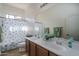 Bathroom with double sinks, large mirror, and decorative accents, blending style and functionality at 16492 N 181St Dr, Surprise, AZ 85388