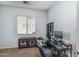 Bedroom featuring a work desk, window, and storage shelves, an ideal workspace at 16492 N 181St Dr, Surprise, AZ 85388