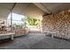 View of the courtyard offering bench seating, stone walls, manicured landscaping, and a relaxing atmosphere at 1702 W Tuckey Ln # 124, Phoenix, AZ 85015