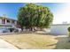 Expansive view of the community grounds showing lush landscaping, mature trees, and walkways at 1702 W Tuckey Ln # 124, Phoenix, AZ 85015