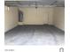 Spacious garage with concrete floor and water heater installed at 1709 W Pollack St, Phoenix, AZ 85041