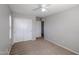 Bedroom with large closet, carpet and view to hallway and second closet at 17474 W Acapulco Ln, Surprise, AZ 85388