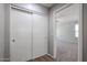 Hallway featuring a closet leading to carpeted loft area with natural light at 17474 W Acapulco Ln, Surprise, AZ 85388