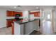 Kitchen area showcasing granite countertops, wooden cabinetry, and modern appliances at 17474 W Acapulco Ln, Surprise, AZ 85388