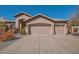 Stunning home showcasing an oversized three car garage and a beautiful well maintained front yard at 1966 E Drake Dr, Tempe, AZ 85283