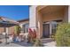 Inviting front entrance with comfortable seating area, lush landscaping, and neutral stucco finish at 1966 E Drake Dr, Tempe, AZ 85283