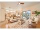 Bright living room showcasing an open concept design that flows into kitchen, with comfortable seating and natural light at 1966 E Drake Dr, Tempe, AZ 85283