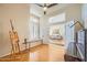 Sitting room with an easel, baby grand piano, window bench and view through double doors to the living room at 1966 E Drake Dr, Tempe, AZ 85283