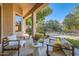 Relaxing covered patio area with stylish outdoor seating and views of the lush backyard at 1966 E Drake Dr, Tempe, AZ 85283