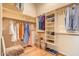 Spacious walk-in closet with built-in shelving, hanging rods and ample storage for shoes, clothes and accessories at 1966 E Drake Dr, Tempe, AZ 85283