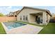 Backyard featuring a pool, covered patio area, and well-maintained landscaping at 22610 N 17Th St, Phoenix, AZ 85024