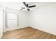 Bright bedroom with laminate flooring, neutral paint, and a large window for natural light at 22610 N 17Th St, Phoenix, AZ 85024