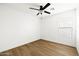 Bright, empty bedroom with ceiling fan, window, and wood-look flooring at 22610 N 17Th St, Phoenix, AZ 85024