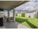 Covered patio with a view of the artificial grass, hardscaped wall, and landscaping at 22864 E Via Del Sol --, Queen Creek, AZ 85142