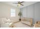 Stylish Bedroom featuring light gray accents, wooden floors, and ample sunlight at 22864 E Via Del Sol --, Queen Creek, AZ 85142