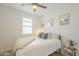 Bright bedroom featuring a window with wooden blinds, and neutral decor at 22864 E Via Del Sol --, Queen Creek, AZ 85142