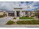 Charming single-story home featuring a manicured lawn, a two-car garage and a welcoming entryway at 22864 E Via Del Sol --, Queen Creek, AZ 85142