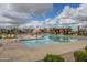 This luxurious community pool boasts plenty of seating, mature landscaping, shade, and clear, cool water at 22864 E Via Del Sol --, Queen Creek, AZ 85142