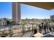 Balcony view with seating area overlooking the street and surrounding buildings under a clear blue sky at 2302 N Central Ave # 412, Phoenix, AZ 85004