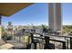 Balcony view featuring a metal table with bar stools, potted plants, and a cityscape view at 2302 N Central Ave # 412, Phoenix, AZ 85004