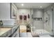 Well-lit bathroom featuring a glass-enclosed shower, soaking tub, and dual-sink vanity at 2302 N Central Ave # 412, Phoenix, AZ 85004