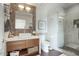 Modern bathroom with a mosaic tile wall, glass shower, floating vanity, and sleek fixtures at 2302 N Central Ave # 412, Phoenix, AZ 85004